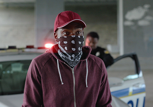 man with his face covered with a hankerchief