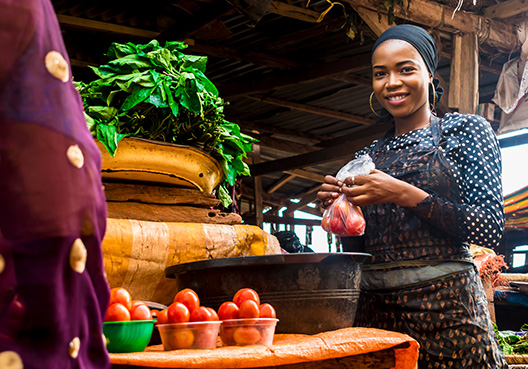 woman at a vegetable market