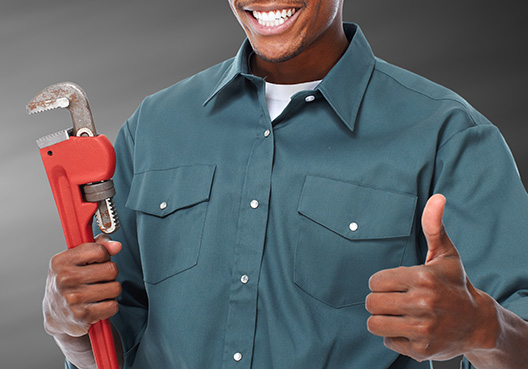 man holding wrench
