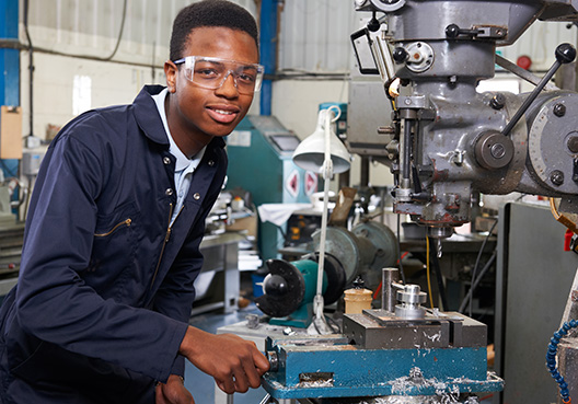 Electronic Equipment man standing by equipment