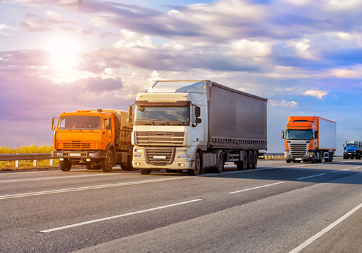 Motor Trade multiple trucks on a road