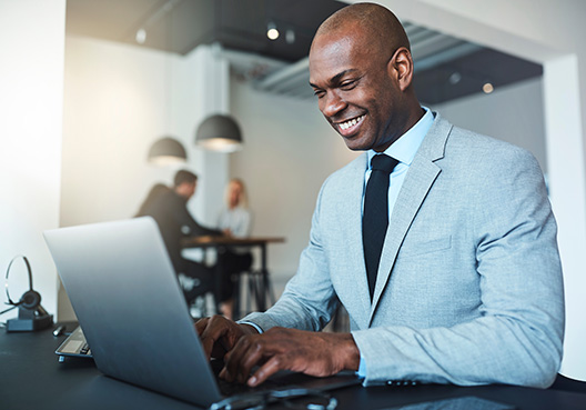 Business man's combined man working on laptop