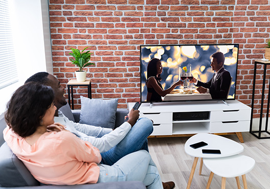couple watching TV couple watching TV